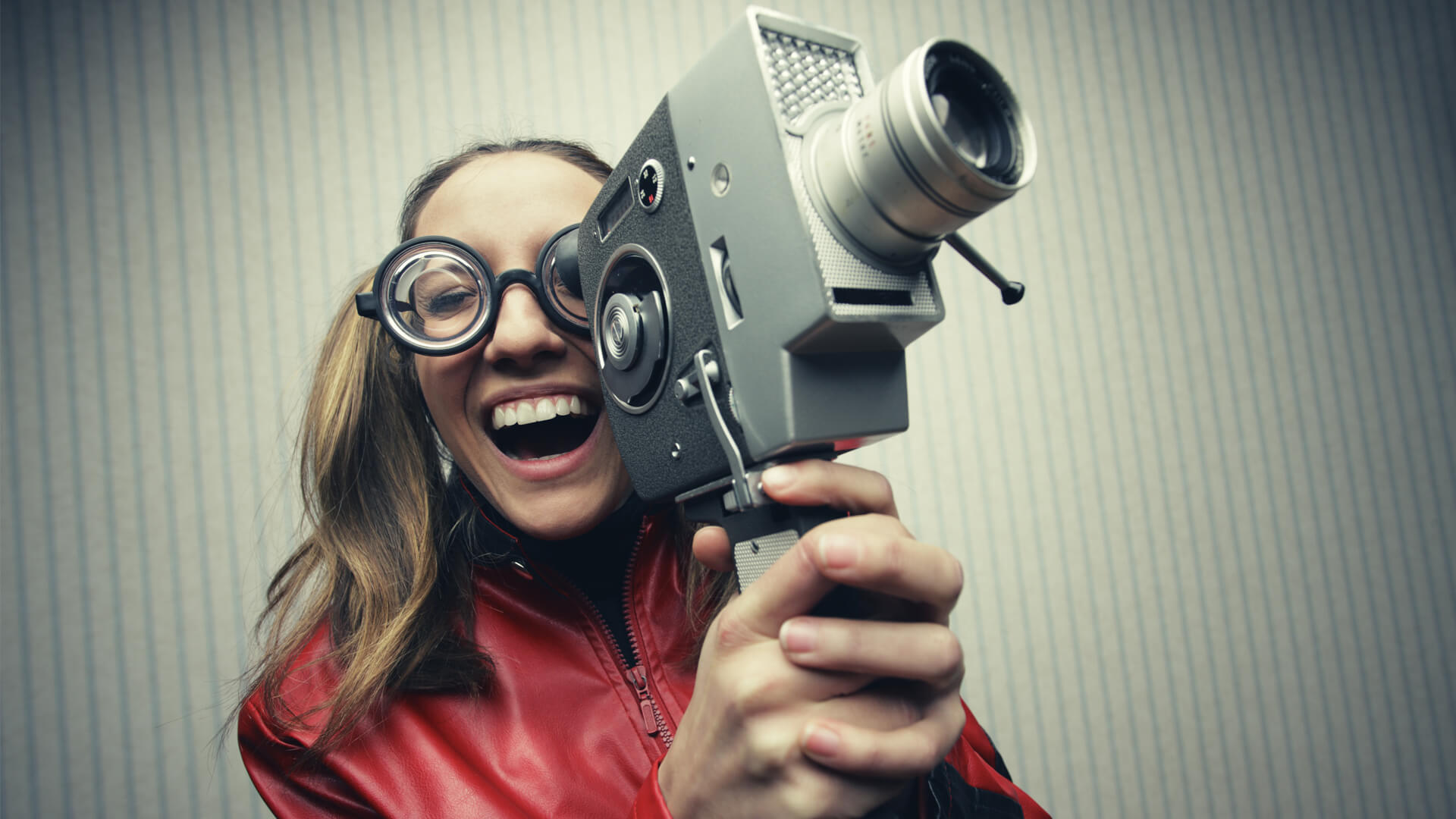 woman holding old video camera